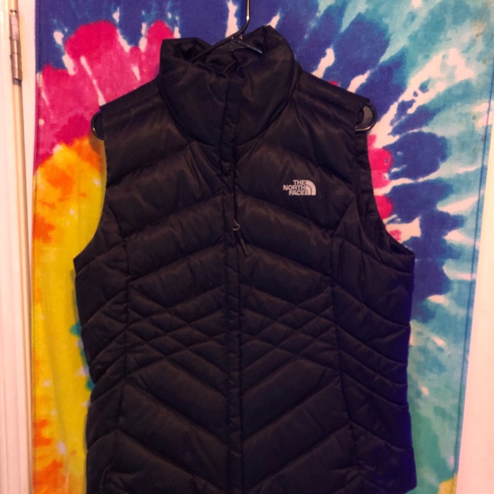The north face black puffy vest